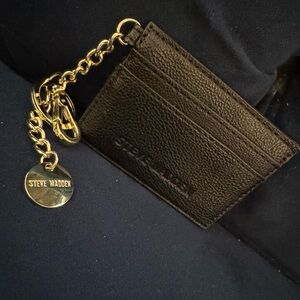 Steve Madden. Small black card holder. Never used.